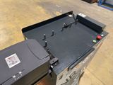 a black box that has a printer on top of it