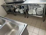 a kitchen with a sink and a microwave on the counter