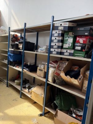 a room filled with lots of boxes and shelves