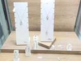 lottie jewelry display in a store with lots of items on it