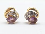 pair of gold and amethorate earrings with diamonds