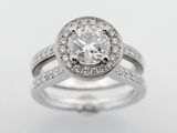 a white gold engagement ring set with a round brilliant cut diamond