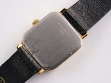 a close up of a wrist watch with a black strap