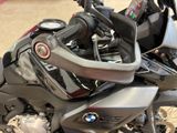 a close up of a motorcycle parked in a showroom