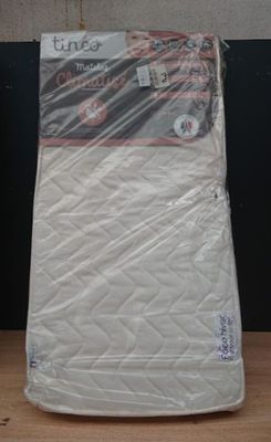 a mattress that is sitting on a table in a room