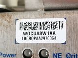 a close up of a metal object with a tag on it