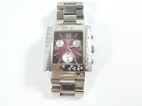 a close up of a watch on a white surface