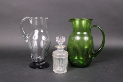 three glass vases sitting next to each other on a table
