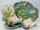 many plates and bowls that are sitting on a table
