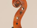 an old violin with a long neck and a curved back
