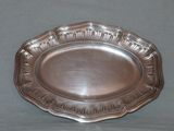 a silver plate that is on a table
