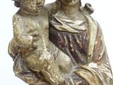 an image of a statue of a woman holding a child