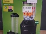 packaging of a blender sitting on top of a wooden table