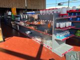 a store with a lot of bottles and containers on the shelves