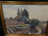 two paintings of a village and a river in a gold frame