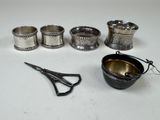 a lot of silver items that are on the table