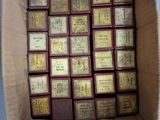 a cardboard box with a bunch of old books inside of it