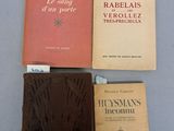 three books are sitting on a table next to each other