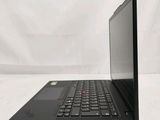 the laptop is open on a white surface with a white background