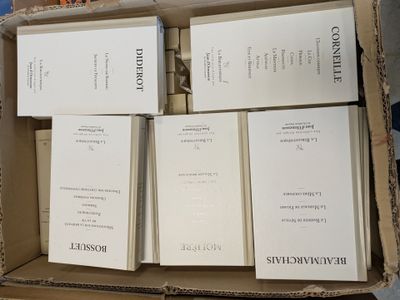 boxes of books are stacked on top of each other in a cardboard box