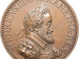 une vieille pièce de bronze représentant le portrait d'un homme barbu