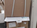 a stack of boxes sitting on top of a refrigerator