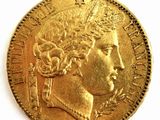 l'image d'une pièce d'or sur laquelle figure le visage d'une femme