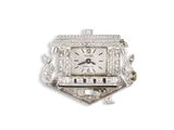 une photo d'une montre en or blanc sertie de diamants