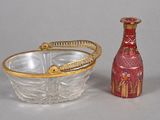 a glass bowl and a glass bottle sitting next to each other
