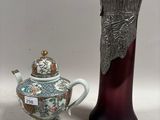 two vases that are next to each other on a table