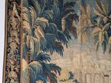 an image of a tapestry hanging on the wall of a room