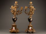 pair of antique brass candelabs with painted vases on stands