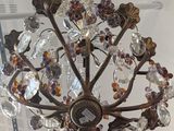 a chandelier hanging from the ceiling in a room