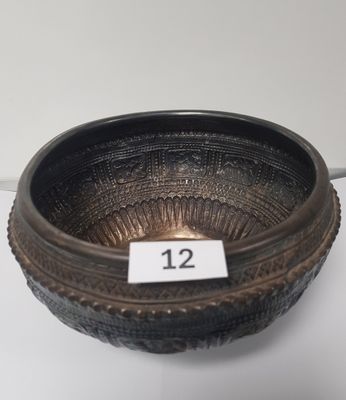 an image of a metal bowl with a number on it