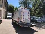 a white van that is parked in a parking lot