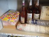 many bottles and cans of wine on a shelf