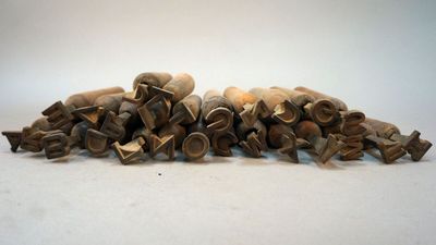 a pile of old toothbrushs sitting on a table