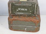 two suitcases stacked on top of each other on a table
