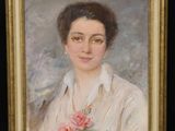 portrait of a woman in a white blouse with a pink rose