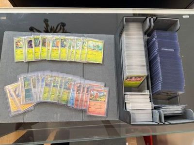 a lot of baseball cards in a case on the table