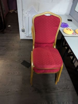 a red chair that is sitting in front of a desk