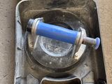 a metal case with a blue handle and a blue handle