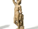 two statues of a man and a woman standing next to each other