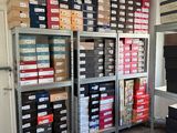 a room with a lot of boxes and boxes on the shelves