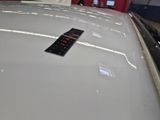 a remote control on the hood of a car