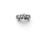 a diamond three stone ring on a white background