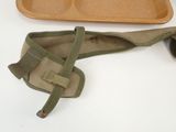 a brown tray with two compartments and a pair of shoes