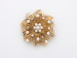 a gold and pearl broochle