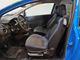 the interior of a small blue car with the door open