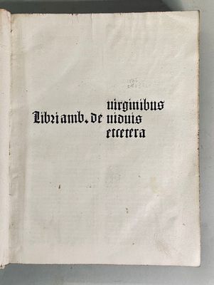 an old book with writing on it sitting on a table